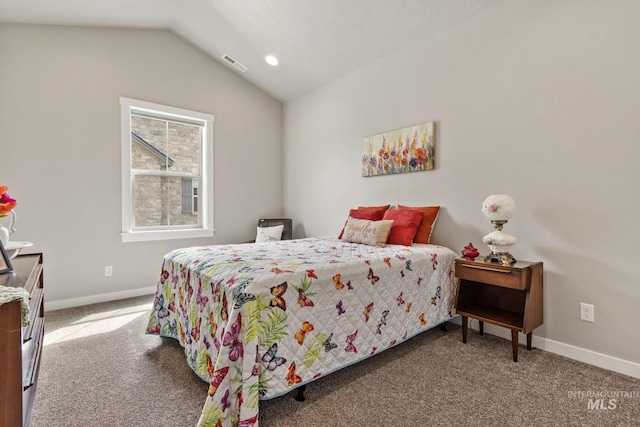 bedroom with baseboards, visible vents, lofted ceiling, and carpet