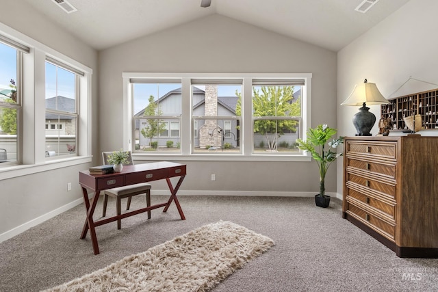 office space featuring carpet floors, visible vents, baseboards, ceiling fan, and vaulted ceiling