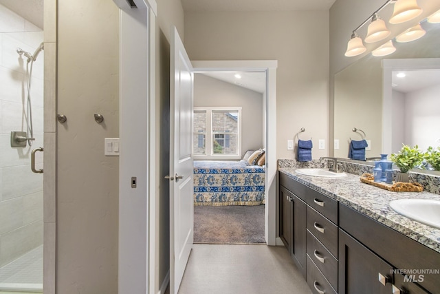 full bathroom with a sink, connected bathroom, and a stall shower