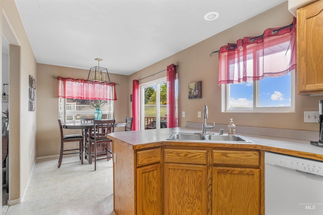 386 E Valleyview Ave, Genesee, ID 83832 - kitchen with dishwasher, a sink, light countertops, light colored carpet, and a peninsula
