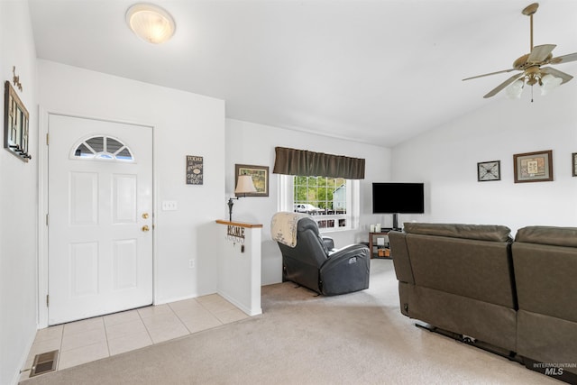 386 E Valleyview Ave, Genesee, ID 83832 - living area with carpet flooring, vaulted ceiling, a ceiling fan, baseboards, and tile patterned flooring