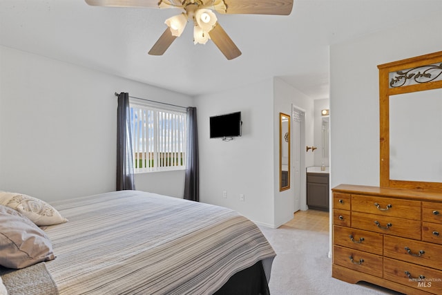386 E Valleyview Ave, Genesee, ID 83832 - bedroom featuring light carpet, ceiling fan, baseboards, and ensuite bath