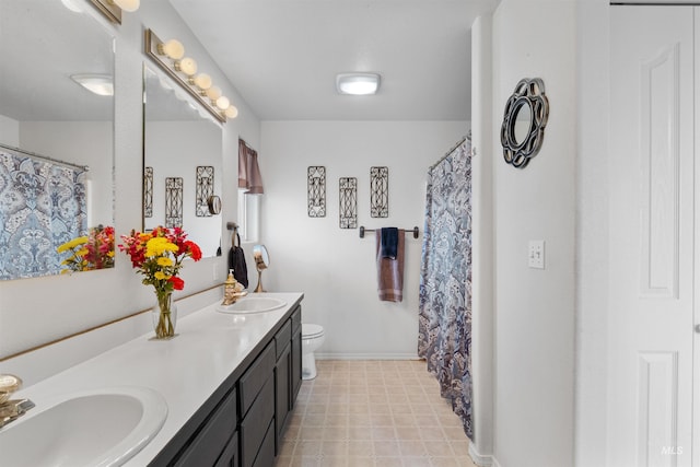 386 E Valleyview Ave, Genesee, ID 83832 - full bath with double vanity, toilet, baseboards, and curtained shower
