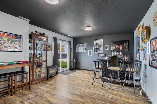 386 E Valleyview Ave, Genesee, ID 83832 - bar with wood finished floors, a textured ceiling, and baseboards