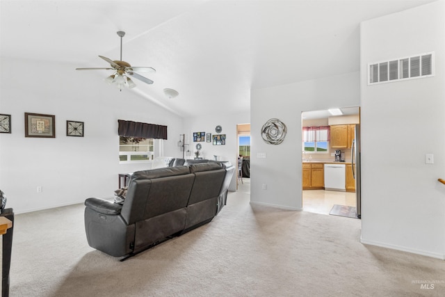 386 E Valleyview Ave, Genesee, ID 83832 - living area featuring light colored carpet, ceiling fan, vaulted ceiling, and baseboards