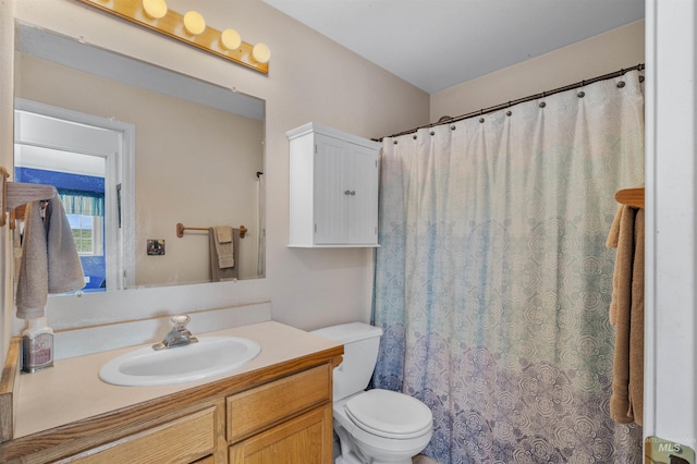 386 E Valleyview Ave, Genesee, ID 83832 - bathroom with toilet, vanity, and a shower with shower curtain