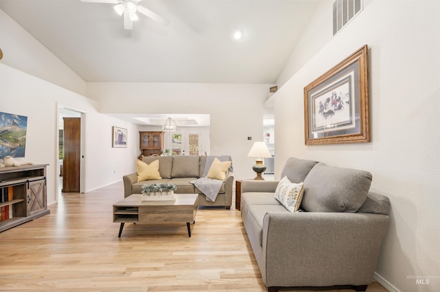 1177 N Lopez Ave, Eagle, ID 83616 - living room featuring lofted ceiling, ceiling fan, and light wood-style floors