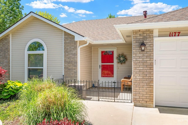 1177 N Lopez Ave, Eagle, ID 83616 - doorway to property featuring fence, a shingled roof, a garage, and brick siding