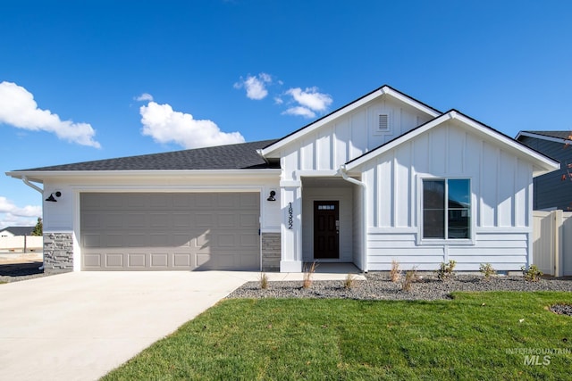 13729 Higley Ct, Caldwell, ID 83607 - ranch-style house featuring board and batten siding, an attached garage, driveway, and a front yard