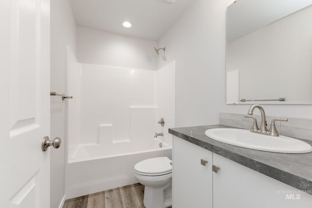 13729 Higley Ct, Caldwell, ID 83607 - bathroom featuring vanity, wood finished floors, shower / washtub combination, and recessed lighting
