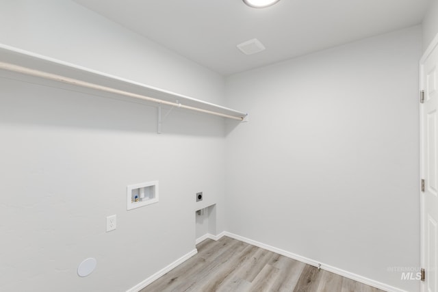 13729 Higley Ct, Caldwell, ID 83607 - washroom featuring washer hookup, light wood finished floors, and electric dryer hookup
