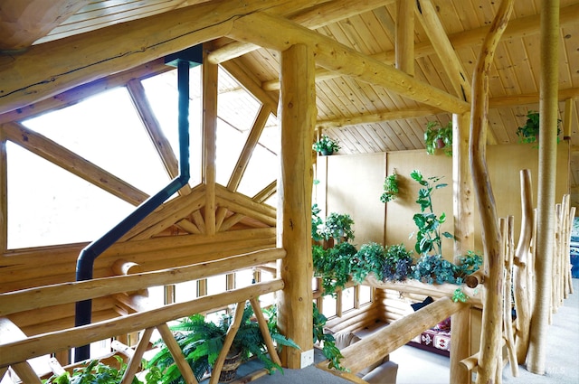 details with light carpet, beamed ceiling, and wooden ceiling