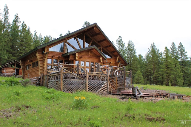 back of house featuring a deck