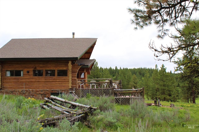 view of property exterior featuring a deck