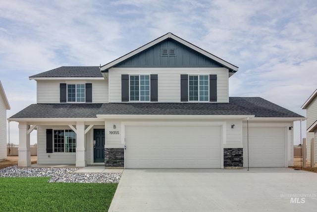 view of front of property featuring a garage and covered porch