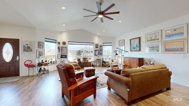 living room with baseboards, ceiling fan, light wood-style floors, recessed lighting, and lofted ceiling