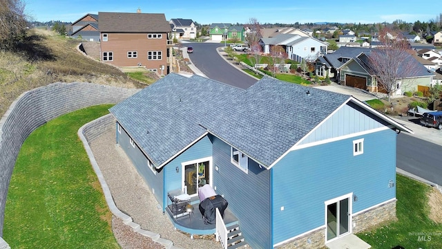 birds eye view of property with a residential view