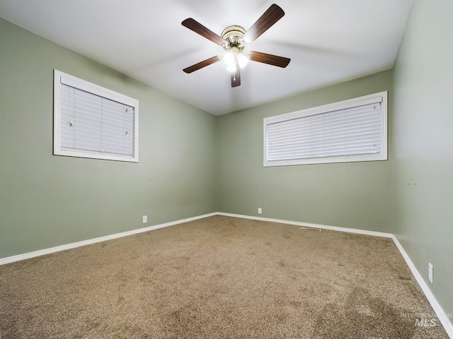 carpeted empty room with ceiling fan