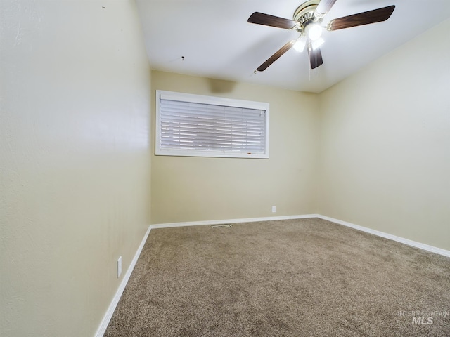 empty room featuring carpet floors and ceiling fan