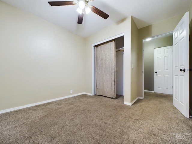 unfurnished bedroom with ceiling fan, carpet floors, and a closet