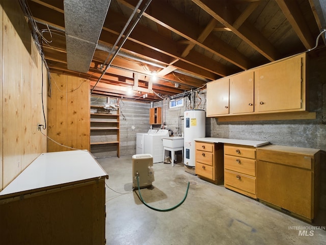 basement with washing machine and dryer and water heater