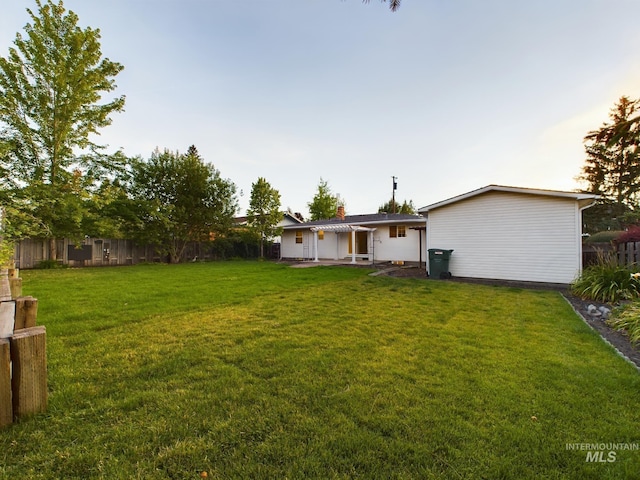 view of yard at dusk