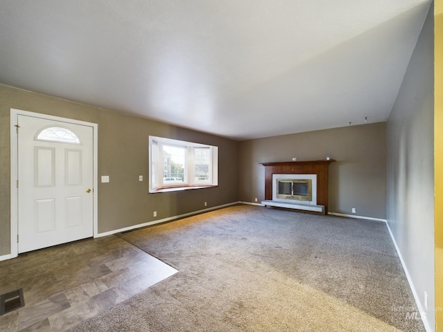 unfurnished living room with carpet