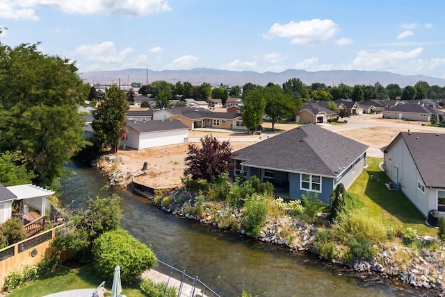 birds eye view of property with a mountain view