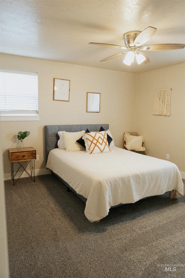 bedroom with ceiling fan and carpet floors