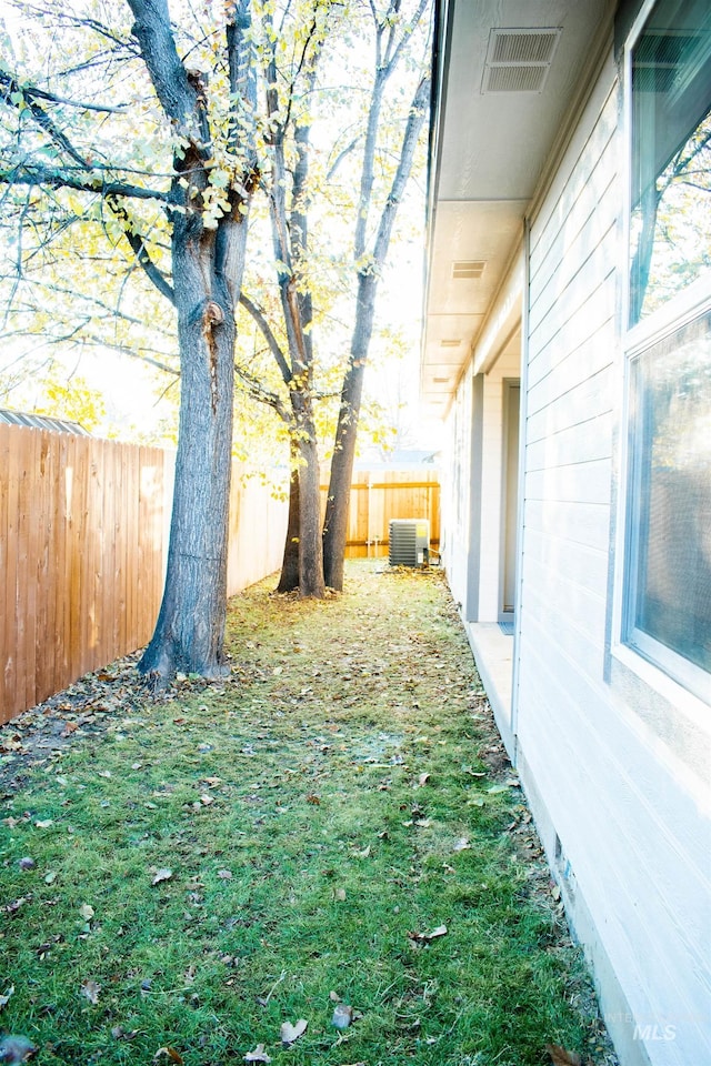 view of yard with central AC unit