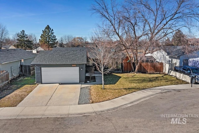 single story home featuring a garage, fence, driveway, roof with shingles, and a front yard