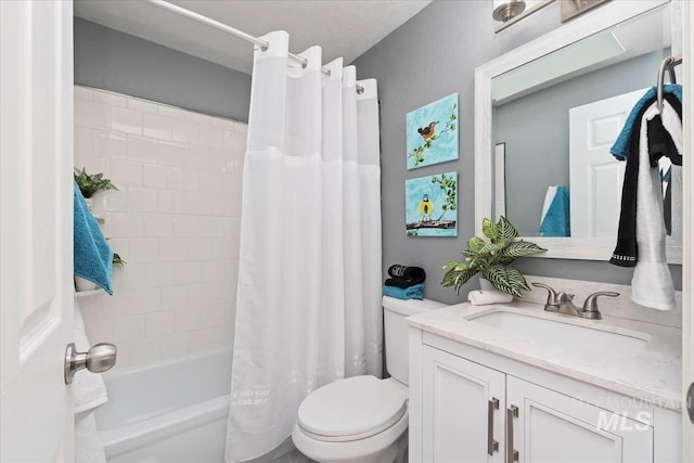 full bathroom featuring shower / bath combo, vanity, and toilet