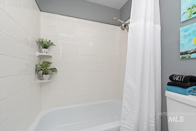 full bathroom with toilet and shower / bathtub combination with curtain