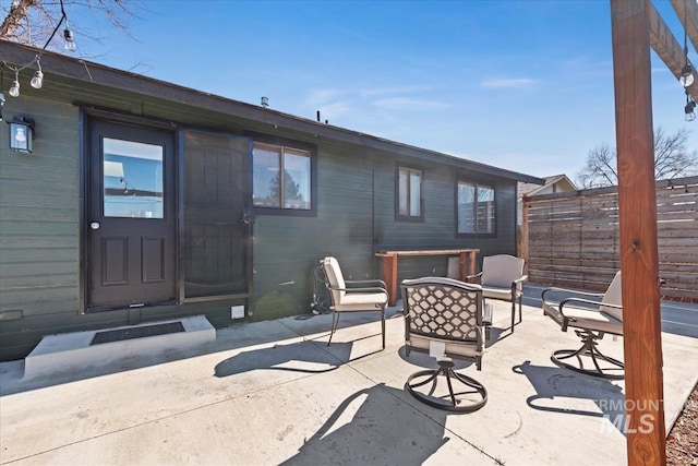 back of house featuring a patio and fence