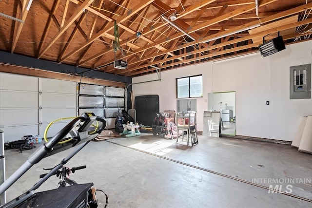 garage featuring a garage door opener and electric panel