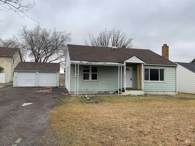 575 Heyburn Ave W, Twin Falls, ID 83301 - view of front facade with a front yard, a garage, and an outdoor structure