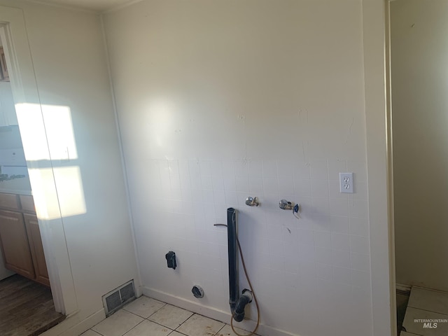 washroom featuring light tile patterned flooring