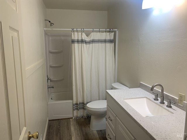 full bathroom featuring shower / tub combo, hardwood / wood-style floors, vanity, and toilet