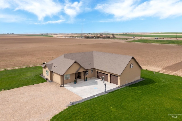 birds eye view of property with a rural view