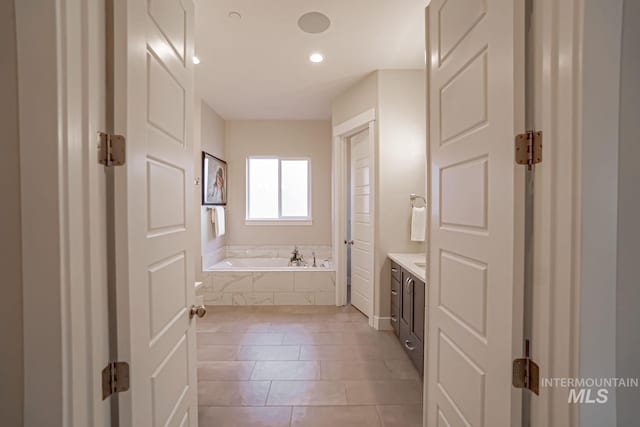 5946 E Barber Dr, Boise, ID 83716 - full bath with tile patterned floors, a garden tub, vanity, and recessed lighting