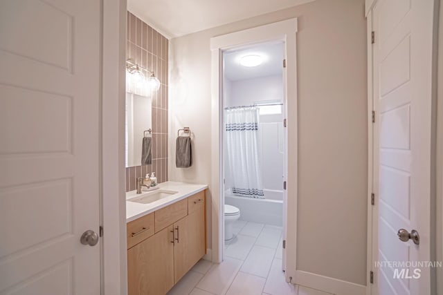 5946 E Barber Dr, Boise, ID 83716 - full bath with baseboards, toilet, shower / bathtub combination with curtain, vanity, and tile patterned flooring