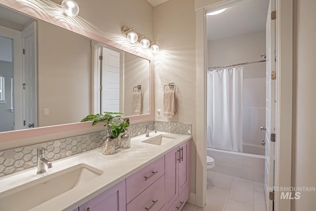 5946 E Barber Dr, Boise, ID 83716 - full bath with tile patterned floors, double vanity, a sink, and toilet