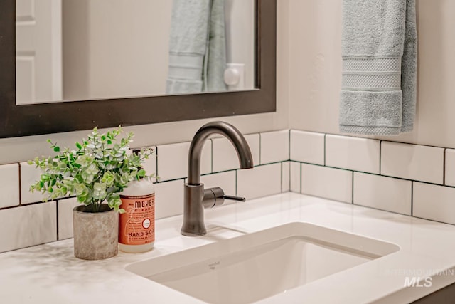 5946 E Barber Dr, Boise, ID 83716 - details featuring a sink and decorative backsplash
