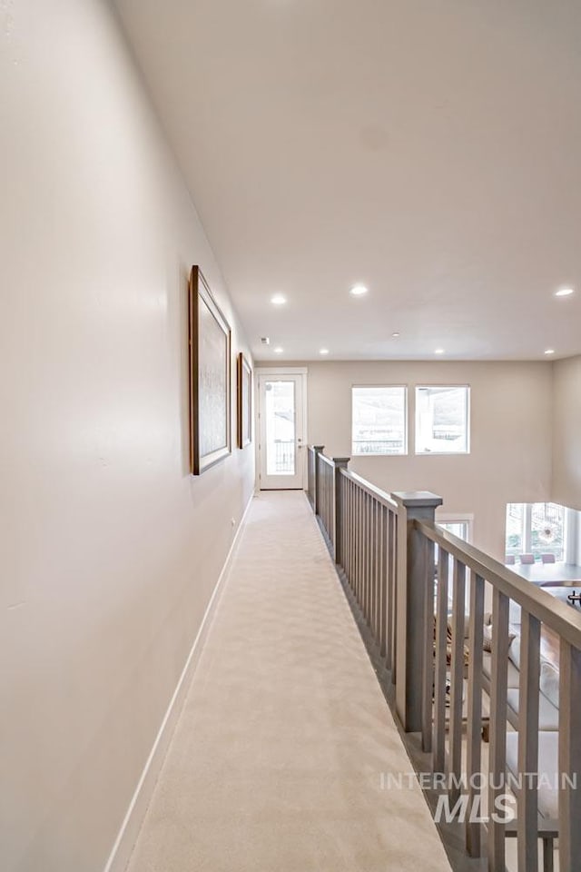 5946 E Barber Dr, Boise, ID 83716 - hall featuring baseboards, recessed lighting, carpet flooring, an upstairs landing, and a healthy amount of sunlight