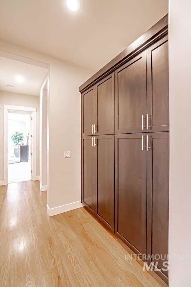 5946 E Barber Dr, Boise, ID 83716 - hall with baseboards and light wood-type flooring