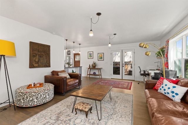 living area featuring french doors and wood finished floors