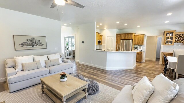 104 E Stonewater, Eagle, ID 83616 - living area featuring wood finished floors, a ceiling fan, and recessed lighting