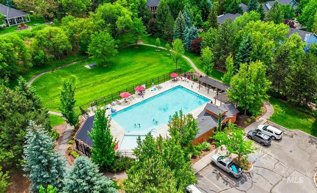 104 E Stonewater, Eagle, ID 83616 - drone / aerial view of a pool and a tree filled landscape
