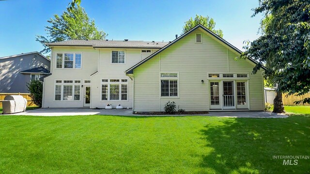 104 E Stonewater, Eagle, ID 83616 - rear view of property featuring a patio and a yard