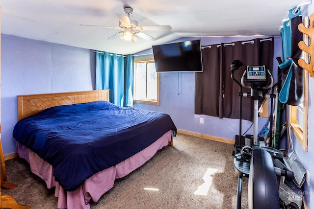 bedroom featuring carpet, vaulted ceiling, and ceiling fan